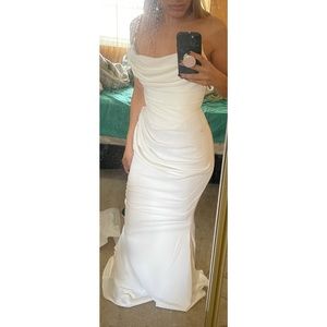 Made of smooth satin. Adj underbust and waist support bands to cinch the figure